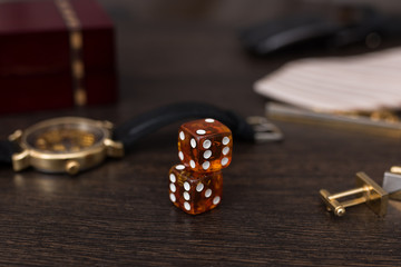 casino gambling, dice close up,amber dice on brown background