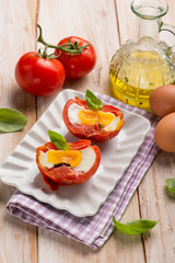tomatoes filled with eggs and basil