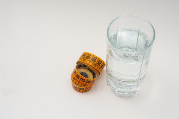 glass of water and measuring tape