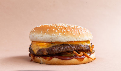 classic burger with cheese on a brown background
