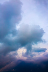 Beautiful purple sky with rainy clouds. Dramatic nature background wallpaper.