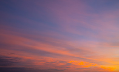 Naklejka na ściany i meble Amazing purple and orange sky with dramatic clouds. Sunset on nature, background wallpaper.