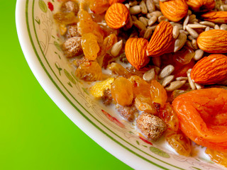 Natural breakfast for better health with muesli and milk. The concept of a healthy diet of people leading a sedentary activity.