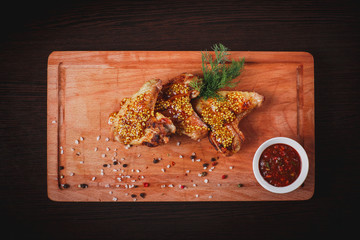 grilled chicken wings on a Board