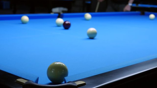 Playing Billiards with white balls. Funny atmosphere park