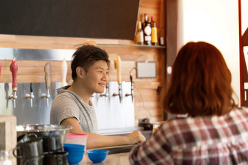 Barkeeper serving customers