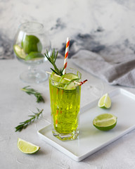 Carbonated green tea with lime and rosemary, refreshing sparkling iced drink