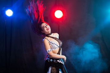 Portrait of a woman in oriental costume performing belly dance. Tribal fusion dance concept.