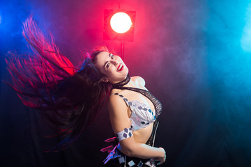 Portrait of a woman in oriental costume performing belly dance. Tribal fusion dance concept.