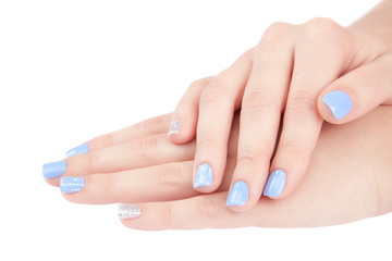 Beautiful female hands with a trendy manicure on white background