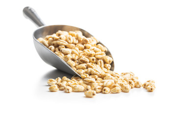 Puffed wheat covered with honey in metal scoop.