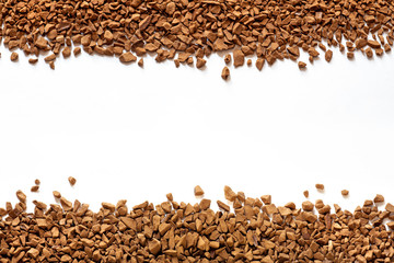 golden color freeze dried coffee, instant coffee granules on a white background close-up, Sublimated coffee texture, free space, place for text in the center