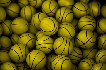 Lots of yellow basketball balls