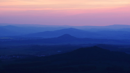 Silhouettes of hills, highlands, ending day.