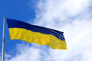 Large national flag of Ukraine flies in the sky. Big yellow blue Ukrainian state flag in the Dnepr city, Independence, Constitution, Defender s Day, National Holiday
