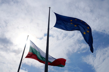 EU and Bulgaria flags waving in the wind against sky