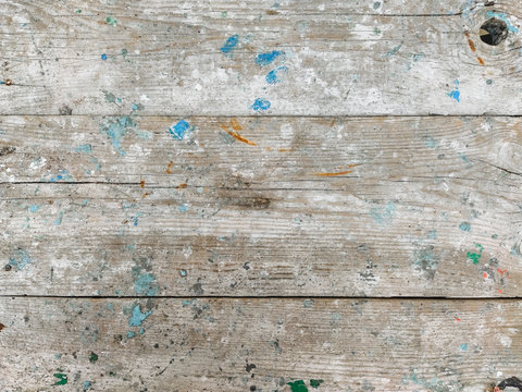 Texture of a dirty, paint-stained gray cracked wood plank. Photography, concept.