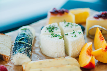 Various kinds of fresh cheese on the plate