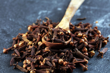freshly dryed cloves spice texture on background