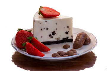 Original recipe cheesecake with chocolate, decorated with strawberries and chocolate on a white...