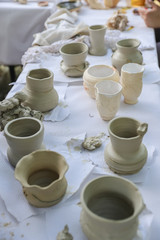 Fototapeta na wymiar Handmade clay products: vases, pots, jars and plates