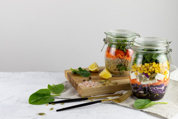 Healthy vegetarian Homemade Mason Jar fresh Salad with Chickpea and Veggies on a light background.Diet, Detox, Clean Eating, Vegan raw food concept.