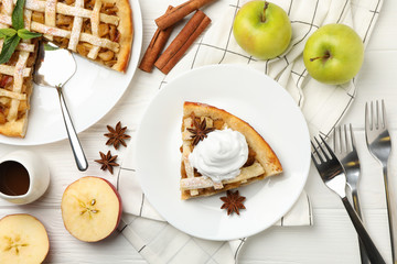 Composition with apple pie on white wooden background. Tasty lunch. Homemade breakfast