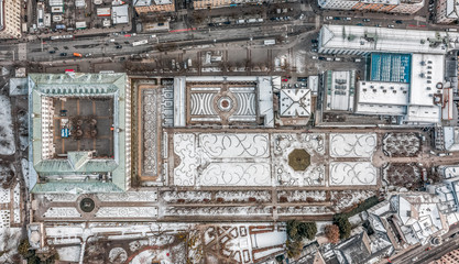 Panoramic aerial overhead drone view of Mirabell Palace in Salzburg coverd with snow in winter time