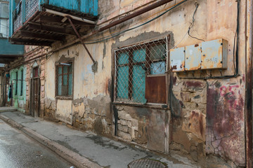 Fototapeta na wymiar Old city with soviet streets and old houses and windows