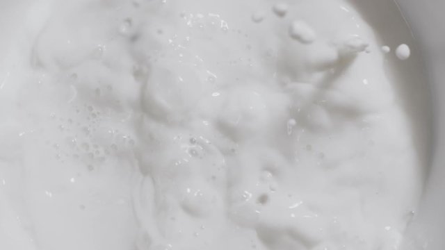 Ripe fresh fores blueberries fall in slow motion to the milk with splashes, making the milk shake, slow motion food, yogurt with berries, milk in slow mo, Full HD 240 fps Prores HQ 10 bit