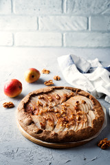 Pear galette cake with walnuts and cinnamon