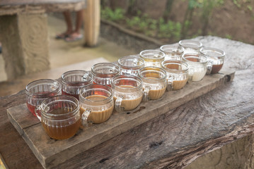 Different types of Luwak Coffee served in a wood table in Bali, Indonesia