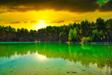 A turquoise lake on sunset. Travel and rest concept. Wonderful views and extraordinary places on earth, sunrise.