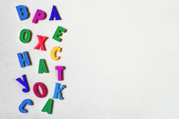 Colorful letters on a light background, magnetic alphabet.