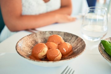 Delicious plate with potatoes and sauce