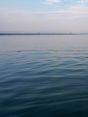 Scenic view of calm blue sea water against sky in Grado, Italy