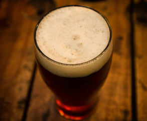 Red and Foamy Cold Craft Beer on the pub table 