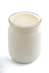 Georgian matsoni yoghurt in a glass pot isolated on white background