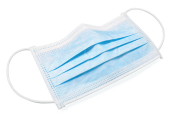 Surgical protective face mask laying on white background