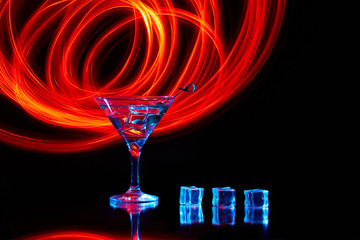 Neon martini glass shot with long exposure. Red club lights.
