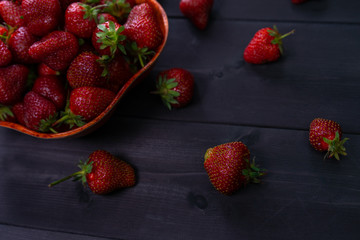 Strawberry is on a wooden background