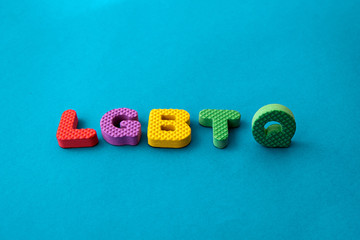 colored letters with word LGBTQ on blue background