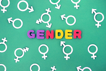 colored letters gender with symbols on green background