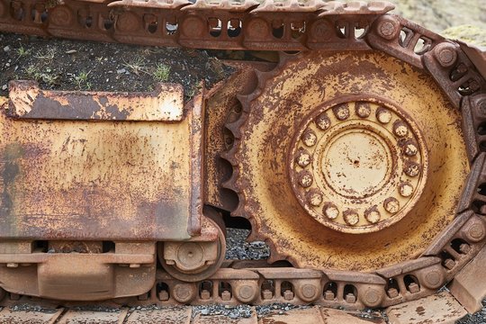 Old excavator rusting in a forest