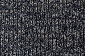 macro photo of warm gray melange polyester sweater with even vertical structure