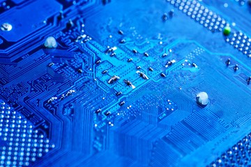 blue circuit board background of computer motherboard,Electronic computer hardware technology.Integrated communication processor. Information engineering component. Blue color.