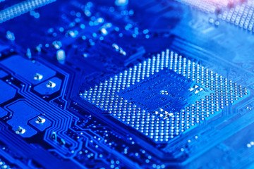 blue circuit board background of computer motherboard,Electronic computer hardware technology.Integrated communication processor. Information engineering component. Blue color.