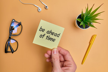 Be ahead of time - english idiom hand lettering on wooden blocks