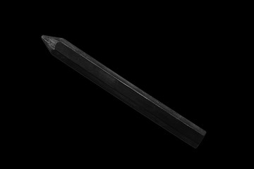 New lead pencil isolated on black background.