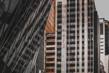 Fototapeta premium Hong Kong Modern Architecture, Hong Kong Business Building Closed up; Black and Gold color